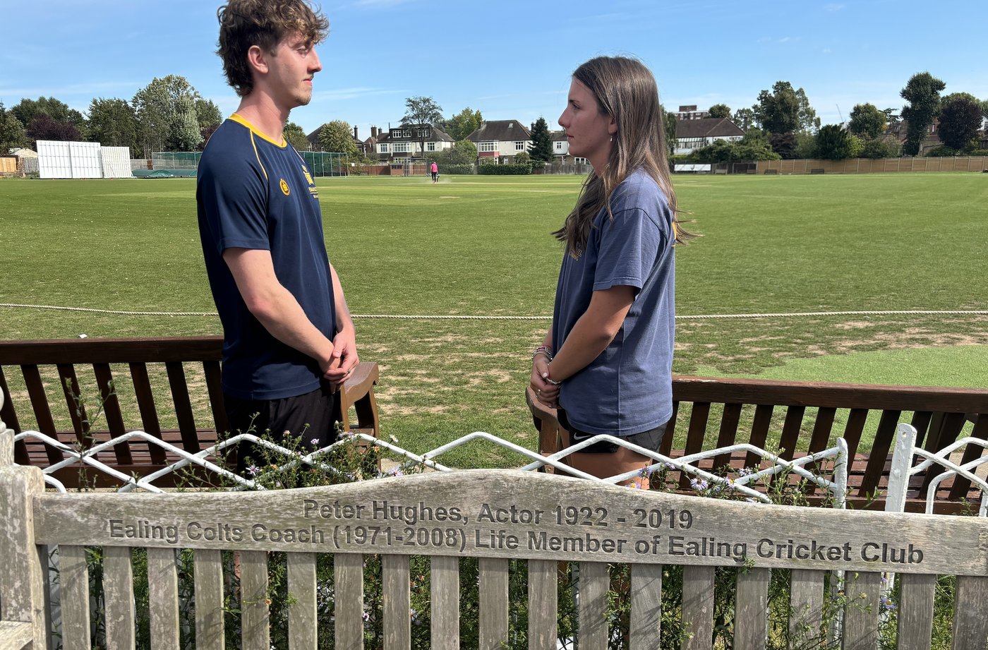 Nancy and Billy Hughes at Ealing Cricket Club, beside the bench dedicated to their grandfather Peter Hughes